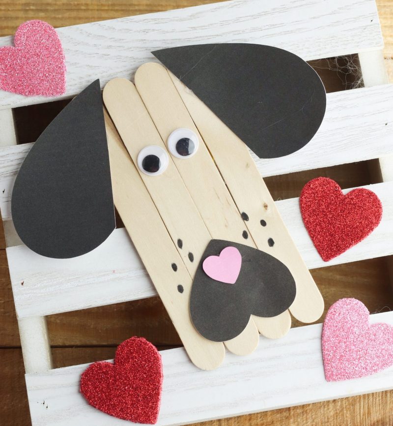 We love rescue dogs! This Puppy Love Valentine Popsicle Stick Craft is just for them! Great for an easy preschool craft (or kindergarten and early primary school) for Valentine's Day or anytime they want to show a bit of puppy love. #KidsCrafts #PopsicleStick #CraftStick #ValentineCrafts #PreK #Preschool #PreschoolCrafts #PreKCrafts #RescueDogs 