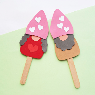 Are you as crazy for adorable gnomes as we are? This Popsicle Stick Kids Craft is so cute! Make DIY Gnome Puppets! Switch up the colors and embellishment on the gnome to change it from a Valentine Craft, to a St. Patrick's Day Craft to a Christmas craft and more! Comes with a free printable template.