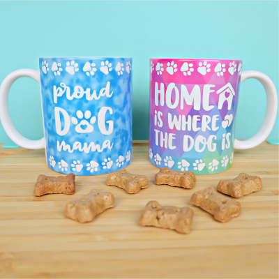 Download 13 free wrapped mug svgs that are perfect for using with the Cricut Mug Press! From dog themed mugs, to funny mugs, to crafty mugs we've got you covered with a ton of adorable designs! Cut using your Cricut Maker, Cricut Explore Air 2 or Cricut Joy! They make great handmade gifts. Includes a two side cut file that says Proud Dog Mama on one side and Home Is Where The Dog is on the other.