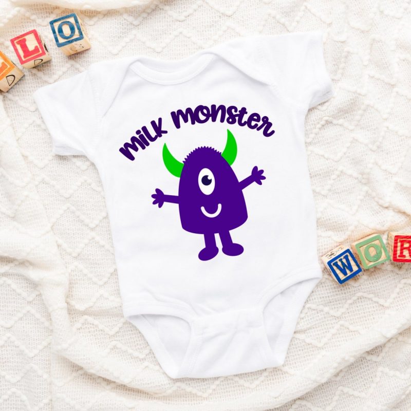 Onesie laying on a baby blanket with an adorable purple monster with green horns. The words Milk Monster are curved above.