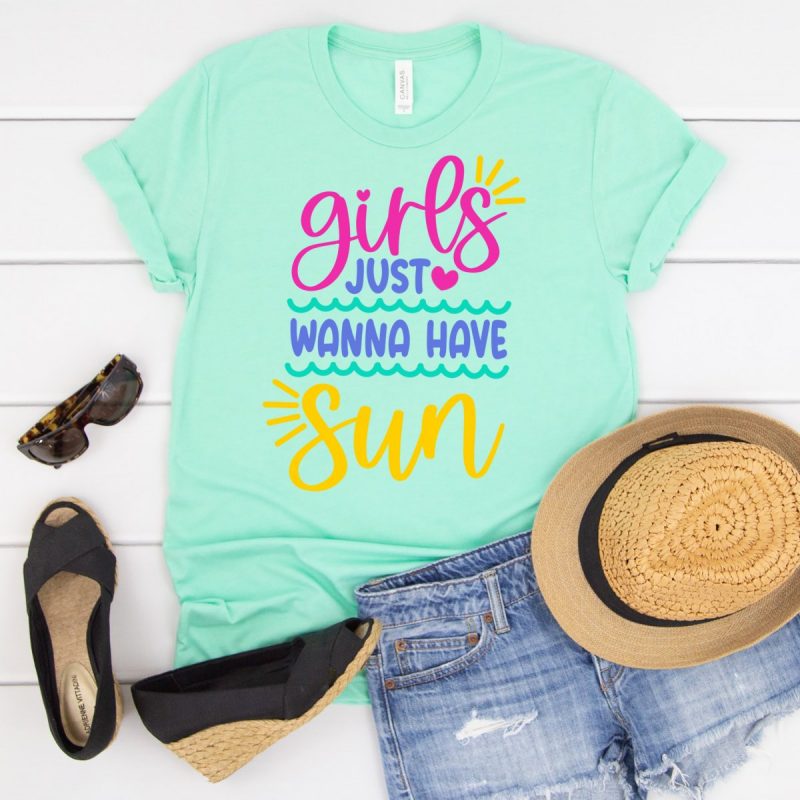 Mint green shirt that reads Girls Just Wanna Have Sun in colorful letters