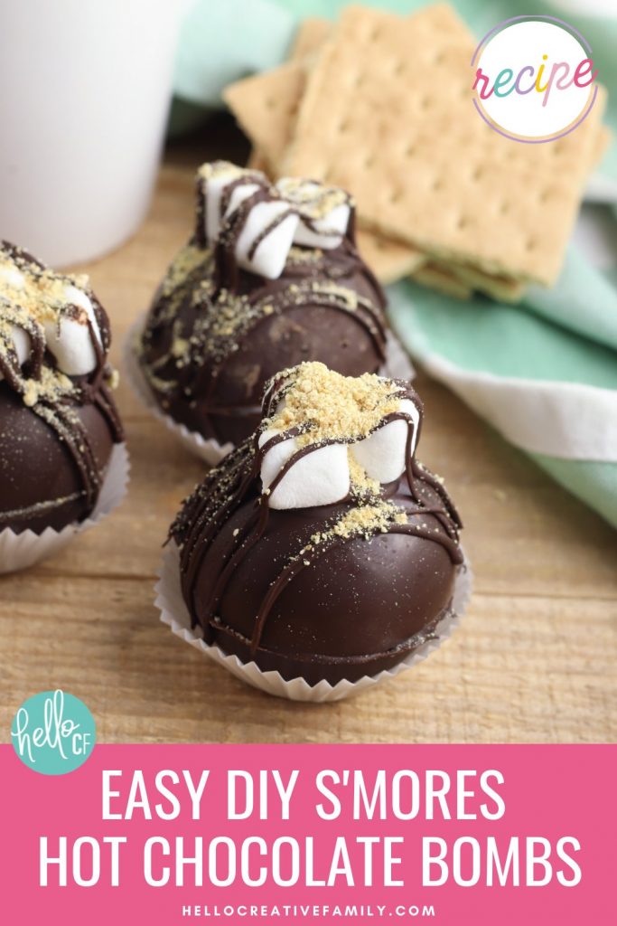Make Easy DIY S'mores Hot Chocolate Bombs that are perfect for taking camping! These sweet treats are so fun to make for the whole family! Learn how to make s'mores hot chocolate bombs with this step by step tutorial! A delicious s'mores dessert drink!