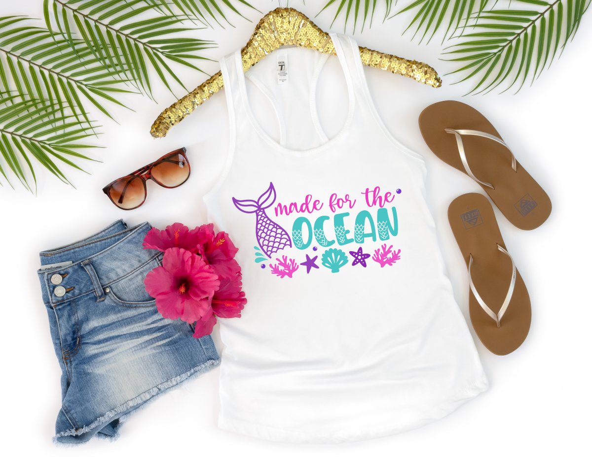 If the beach is your happy place, then this free cut file is for you! Make DIY tank tops, onesies, mugs, beach bags and more with this Made For The Ocean Mermaid SVG File! Get your craft on with your Cricut, Silhouette or other electronic cutting machine. So much fun for mermaid birthday parties or mermaid lovers with summer birthdays!