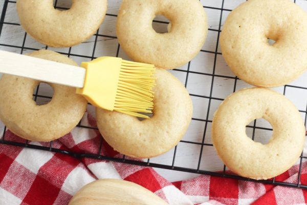 Brush the donuts with the melted butter.