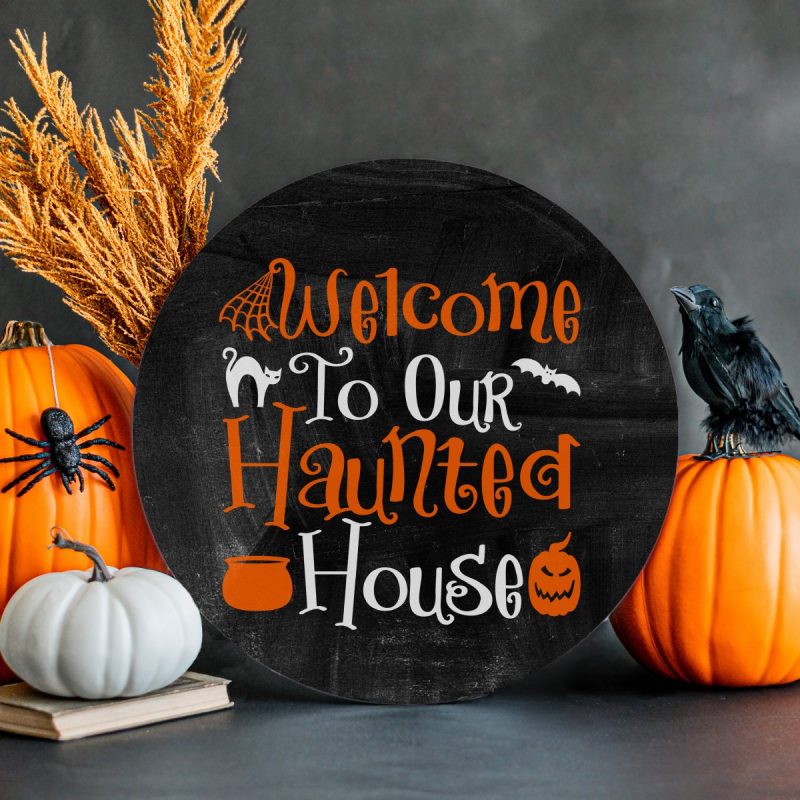 DIY Welcome to Our Haunted House sign made with the Cricut. 
