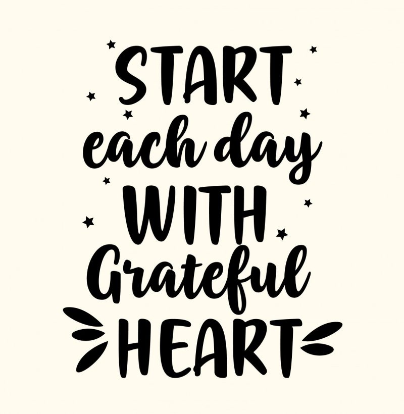 Hand lettered image that says Start Each Day With A Grateful Heart