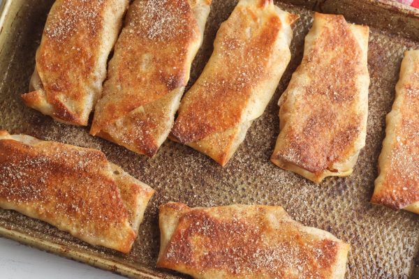 Bake in the preheated oven for 15 minutes, flipping the egg rolls hallway through the cook time.