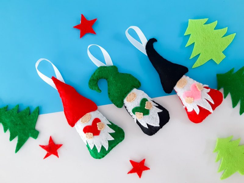 Bring a burst of cheerfulness to your home by making these cute DIY Christmas gnome ornaments. This sweet sewing project is perfect for beginners. Includes a free printable pattern template and step by step photos. Not into sewing? Make this a no-sew Christmas project with a bit of glue!