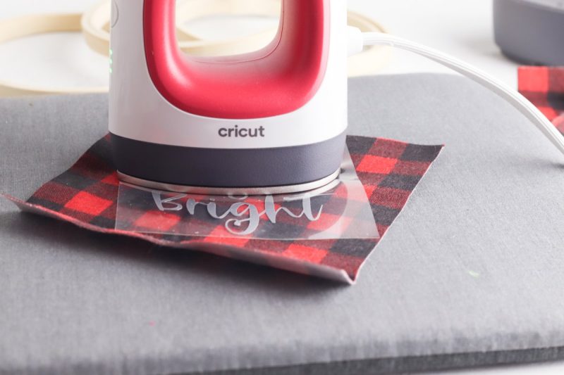  Use the Easy Press or iron to transfer the vinyl to the fabric. 