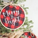 Learn how to make Buffalo plaid ornaments with the help of the Cricut Explore Air, Cricut Maker or Cricut Joy. These DIY Buffalo Plaid Christmas Ornaments combine mini embroidery hoops and HTV to make a quick and easy Christmas craft to decorate your Christmas tree! Includes three free Christmas SVGs!