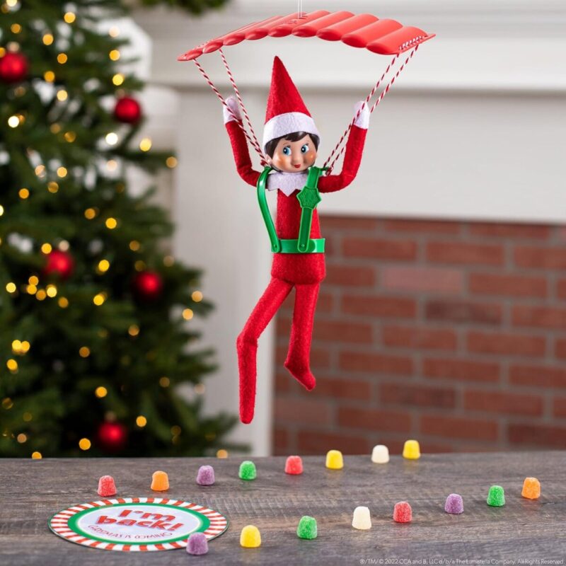 Elf On The Shelf riding a parachute