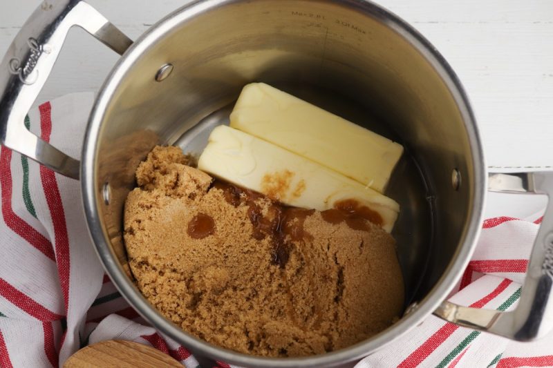 Make the caramel sauce by adding the butter, brown sugar, corn syrup, and salt to a small saucepan. Cook over medium heat, stirring constantly with a wooden spoon. Melt the butter then allow the mixture to simmer for 5 minutes, stirring the whole time.