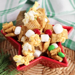 Chex Mix is a classic Christmas snack that is always a hit at holiday parties. This quick and easy Chex Mix recipe is sure to please any sweet tooth on your list. The secret ingredients are caramel and popcorn! Put it in a fun and festive bag or container for a great holiday gift idea for the foodie, or a sweet treat for a Christmas hostess gift!