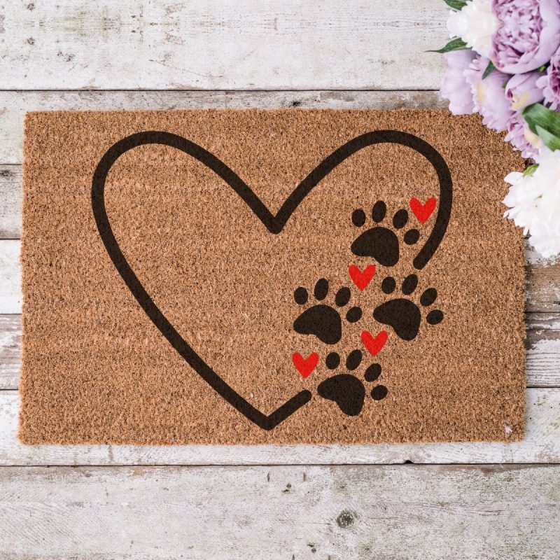 Heart Paw Print SVG cut out of freezer paper and stencilled onto a coir door mat.