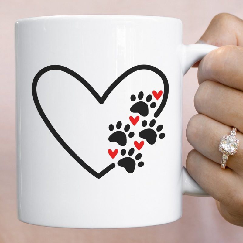 Heart Paw Print SVG cut out of vinyl and applied to a mug.