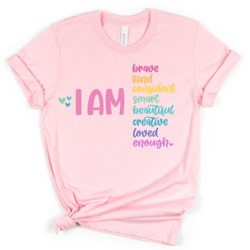 Pink shirt decorated with affirmations. Free cut file from Hello Creative Family. Perfect for DIY Pink Shirt Day shirts made with your Cricut.