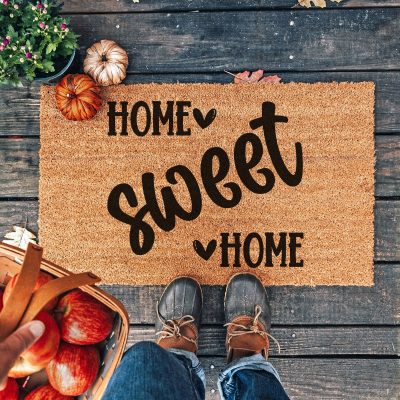 Welcome guests to your home with a DIY welcome mat that you made with your Cricut! We're sharing 16 free welcome svg files! From funny to sweet we've got you covered including a free Home Sweet Home SVG File. We're also sharing step by step instructions on how to make a door mat using your Cricut and freezer paper!