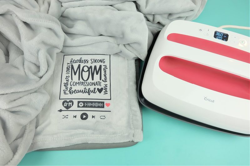 Once your blanket has cooled, carefully peel up the Infusible Ink Transfer Sheet revealing your design beneath! 