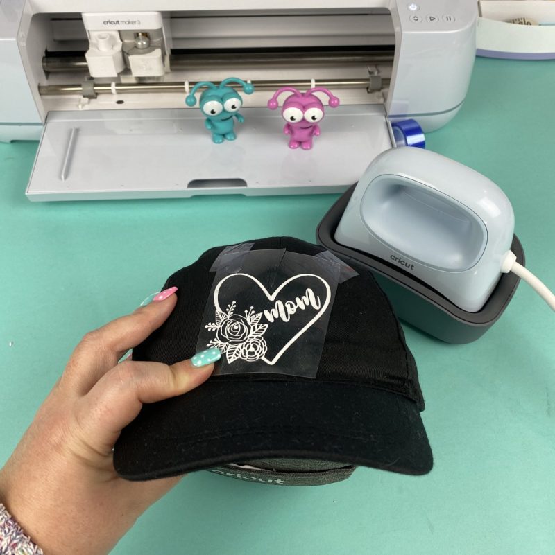 Design taped to Cricut Hat for heating with Cricut Hat Press