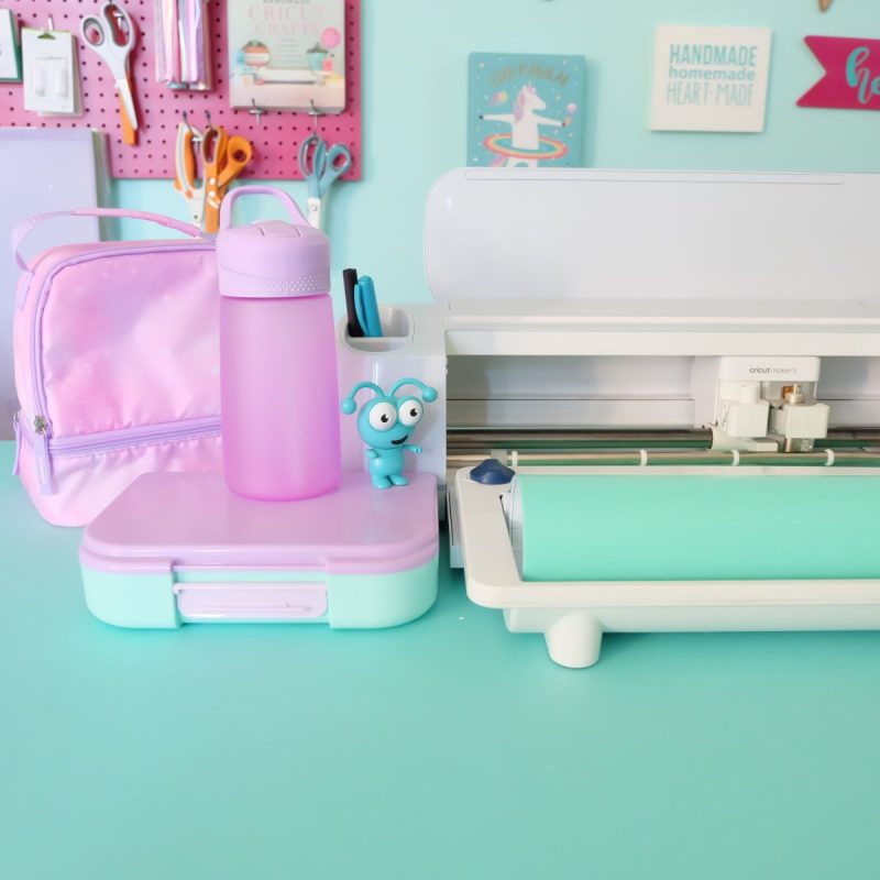 Cricut maker with teal vinyl
