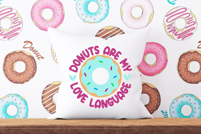 If you love sweet food puns then this is the cut file bundle for you! We're sharing free donut SVG files that you will love! Use them for making mugs, hoodies, t-shirts, throw pillows, tote bags and and so many more cutting machine crafts using your Cricut Maker, Cricut Explore, Cricut Joy or Silhouette Cameo. Includes Donuts Are My Love Language.