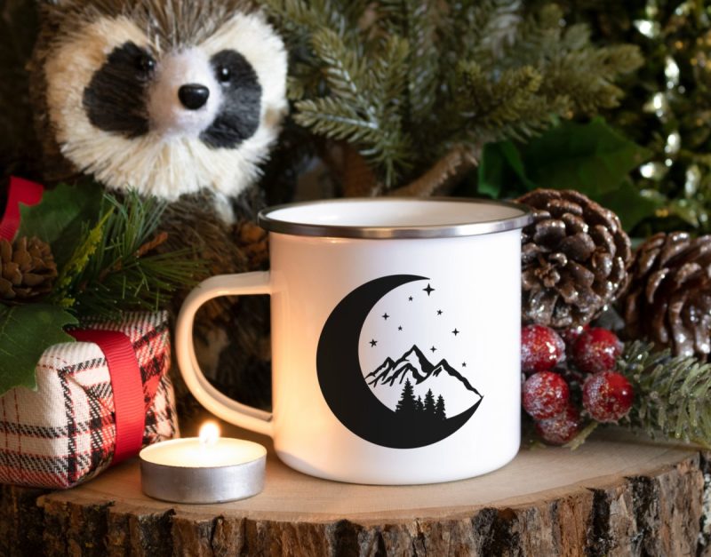 Moon, stars, mountain and trees on a mug
