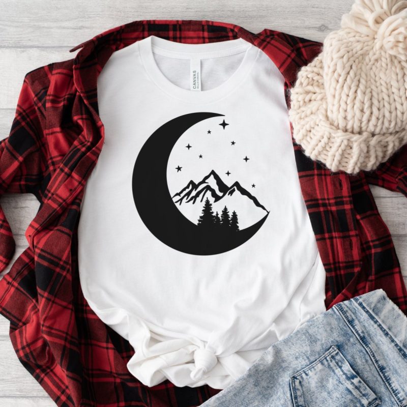Moon, stars, mountain and trees design on a tshirt with a red flannel.
