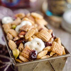 This Chex Mix is the best of sweet and salty. Yogurt covered pretzels and sweetened dried cranberries are paired with honey cinnamon cereal for an amazing snack! 