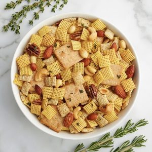 A sophisticated, seasoned and herbed mix of Corn and Rice Chex&trade; cereals, mixed nuts and bite-size crackers, perfect for serving at a holiday cocktail party.