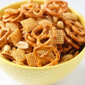 A classic holiday party snack made even easier with this Crockpot Chex Mix recipe! The honey coating hardens into a shiny, sweet glaze that works deliciously with all of the different mix-ins, to make a salty-sweet, crunchy party mix that you won&rsquo;t be able to stop eating!
