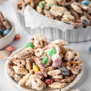 This White Chocolate Chex Mix is the all-time best savory & sweet snack! This recipe is so easy, made in 10 minutes, and seriously addictive. Add holiday-colored m&ms for a festive twist!