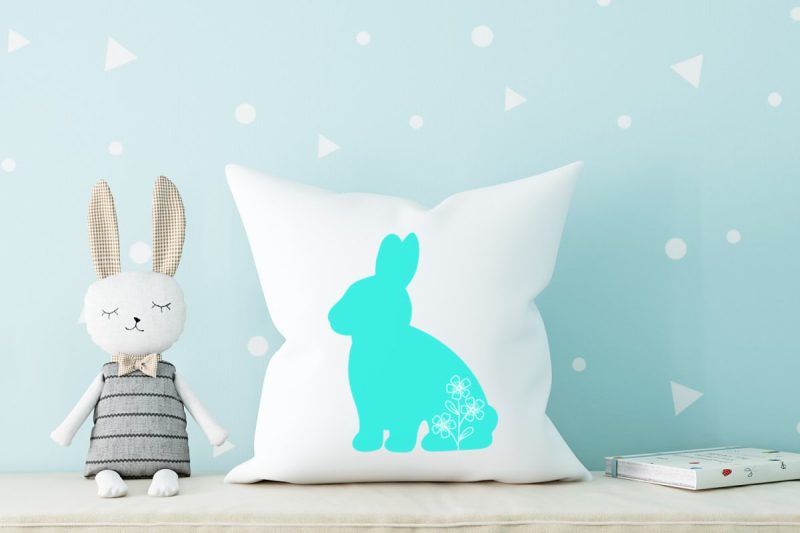 Easter throw pillow with teal floral Easter bunny on the front