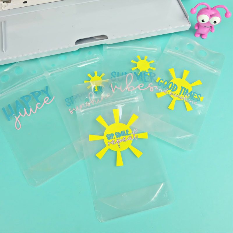 carefully peel up your transfer tape making sure each piece of your design is attached to the transfer tape. Position your transfer tape where you would like your design on your drink pouch. Use your scraper tool to burnish the vinyl onto the drink pouch. Slowly peel up the transfer tape leaving your vinyl design behind on your drink pouch. Repeat for each piece/color of your design.