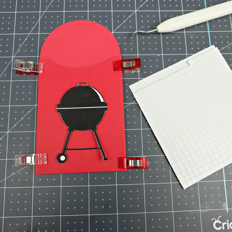 Pieces of a Cricut BBQ utensil holder laying on a work surface waiting to be assembled