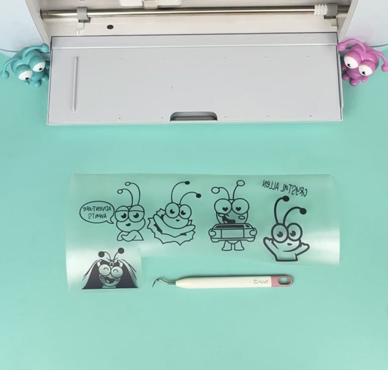 Cricut cuties weeded out of a sheet of htv.