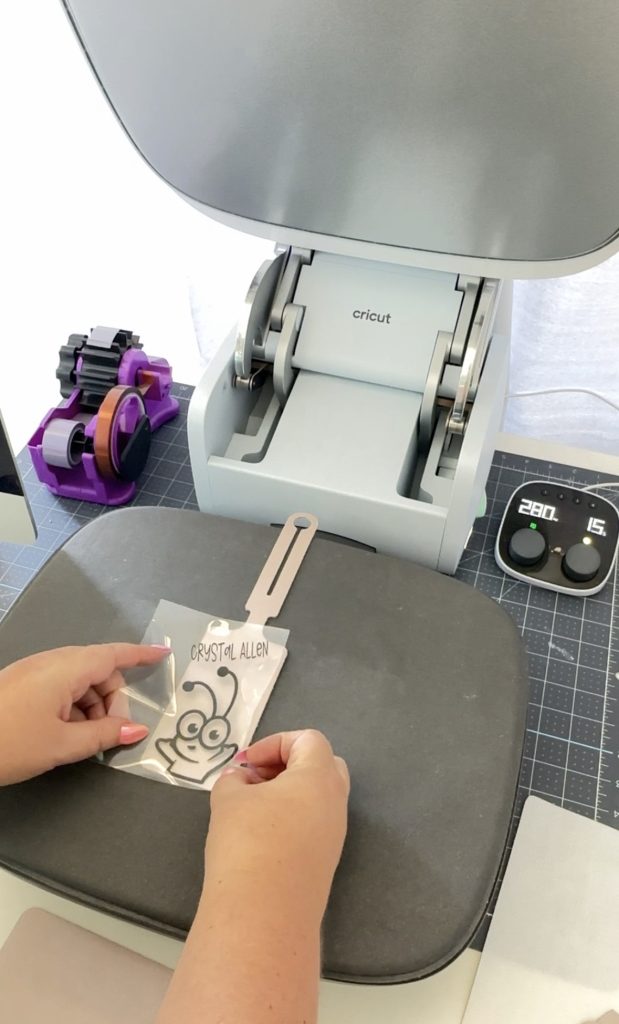 Cricut AutoPress with a Cricut Luggage tag with a Cricut Cutie Design.