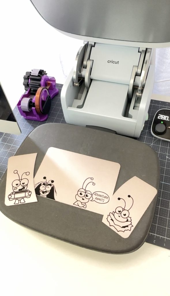Cricut AutoPress with Cricut passport pieces with Cricut Cutie Designs.