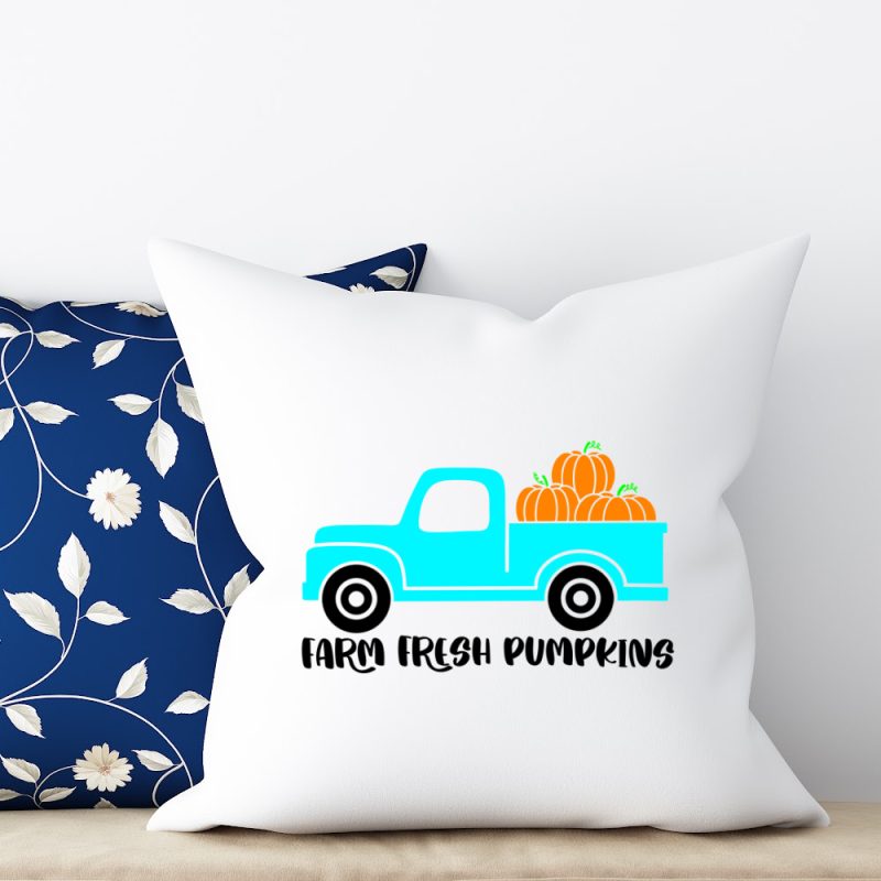 Throw pillow with a design that reads Farm Fresh Pumpkins with an adorable blue vintage truck From Crystal at Hello Creative Family.