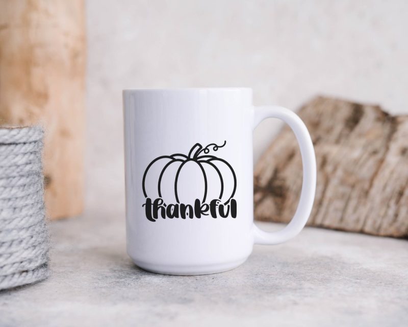 White Mug with a Thankful Pumpkin design From Crystal at Hello Creative Family on the front. Perfect for fall and Thanksgiving!