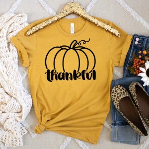 Yellow shirt with a Thankful Pumpkin design From Crystal at Hello Creative Family on the front. Perfect for fall and Thanksgiving!