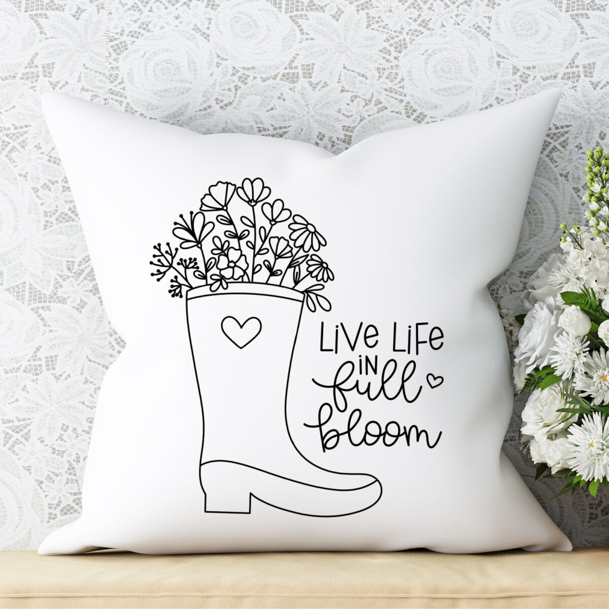 Live Life In Full Bloom throw pillow with rain boot filled with wildflowers
