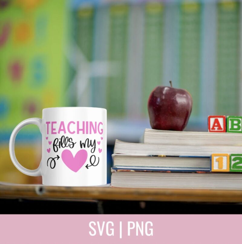 Teaching Fills My Heart SVG From Hello Creative Family on a white mug