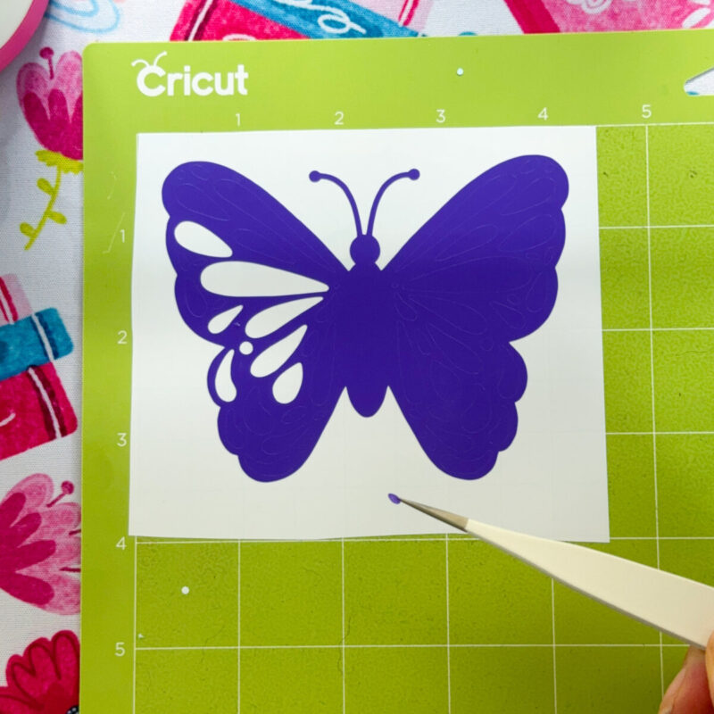 Weeding Cricut Vinyl with fine tip tweezers