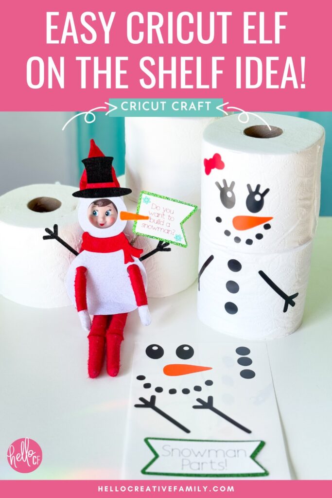 Close-up of an Elf on the Shelf wearing a snowman outfit made from felt, with toilet paper snowmen decorated with carrot nose and button decals.