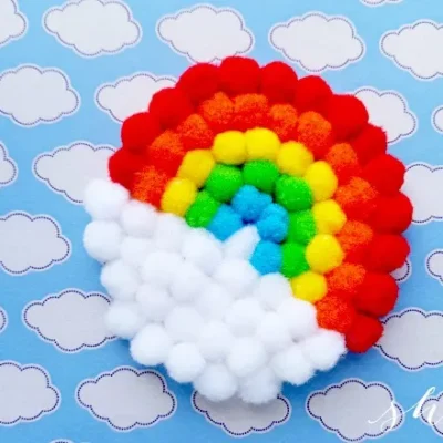 DIY Pom-Pom Rainbow Craft From She Saved