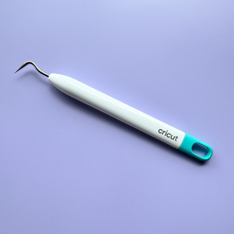 Cricut weeding tool on purple background