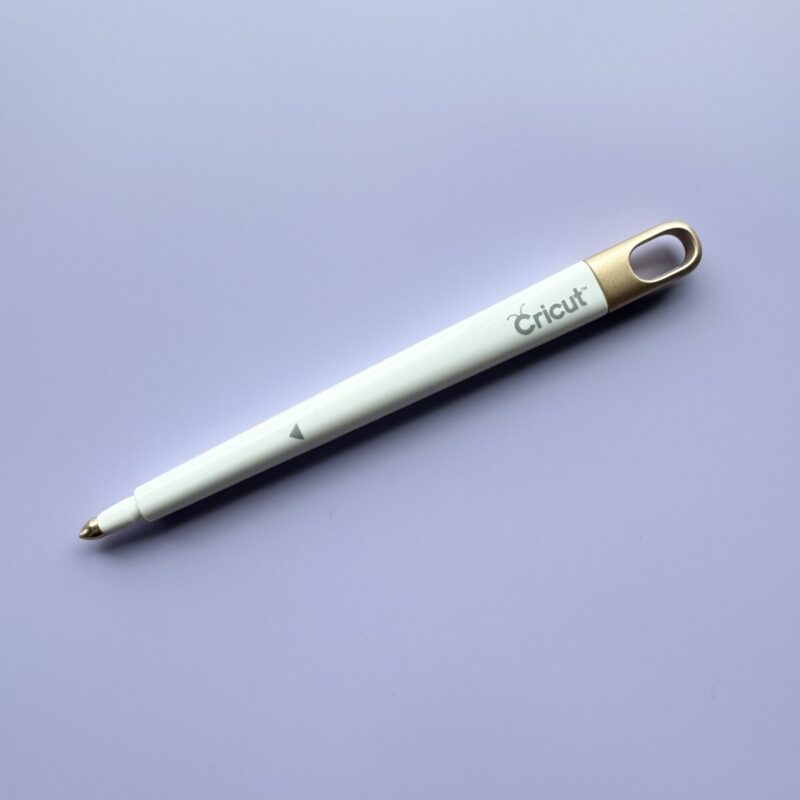 Cricut scoring tool on purple background