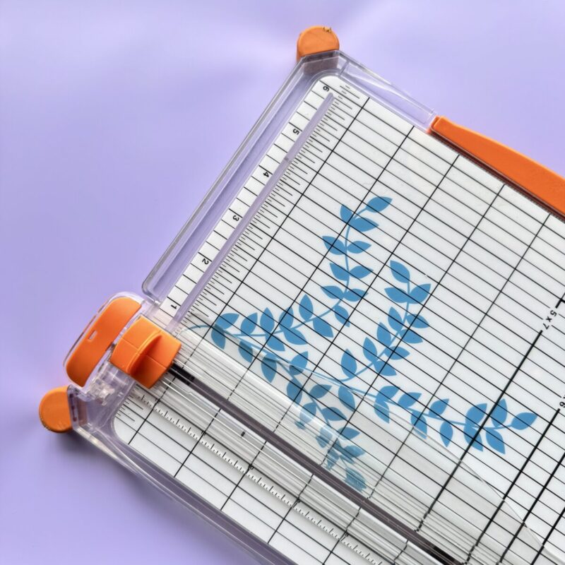 Paper Trimmer Tool on purple background