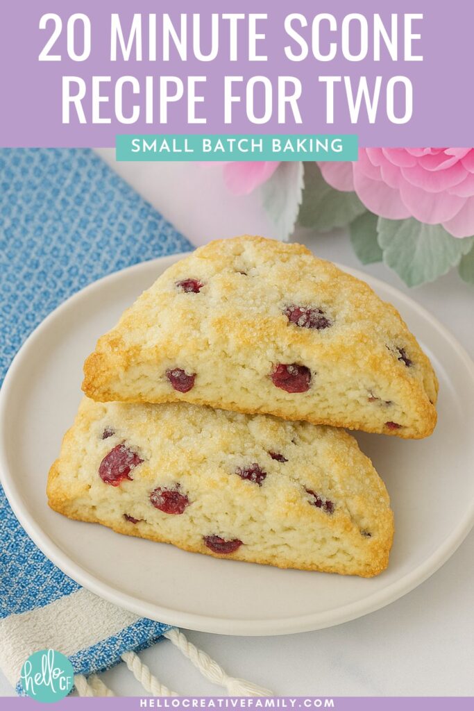Two scones sitting on a white plate with a blue towel and pink flowers. 20 Minute Start To Finish Scone Recipe for Two... or One