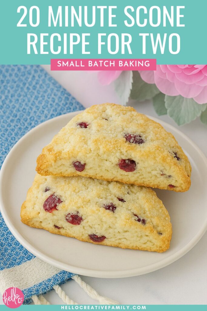 Two scones sitting on a white plate with a blue towel and pink flowers. 20 Minute Start To Finish Scone Recipe for Two... or One